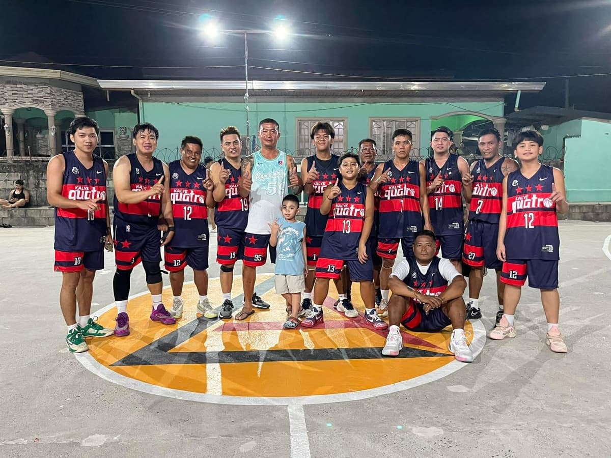 Kalye Quatro basketball team in matching navy and red Big Game jerseys on an outdoor court