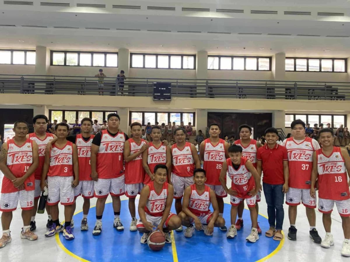 Sitio Tres team in red and white jerseys on an indoor court